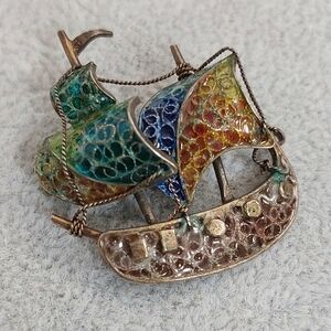 Vintage viking enamel metal brooch.